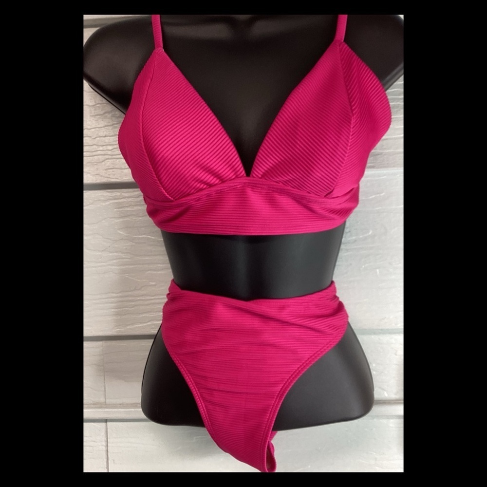 Pink textured two-piece swimsuit. 60